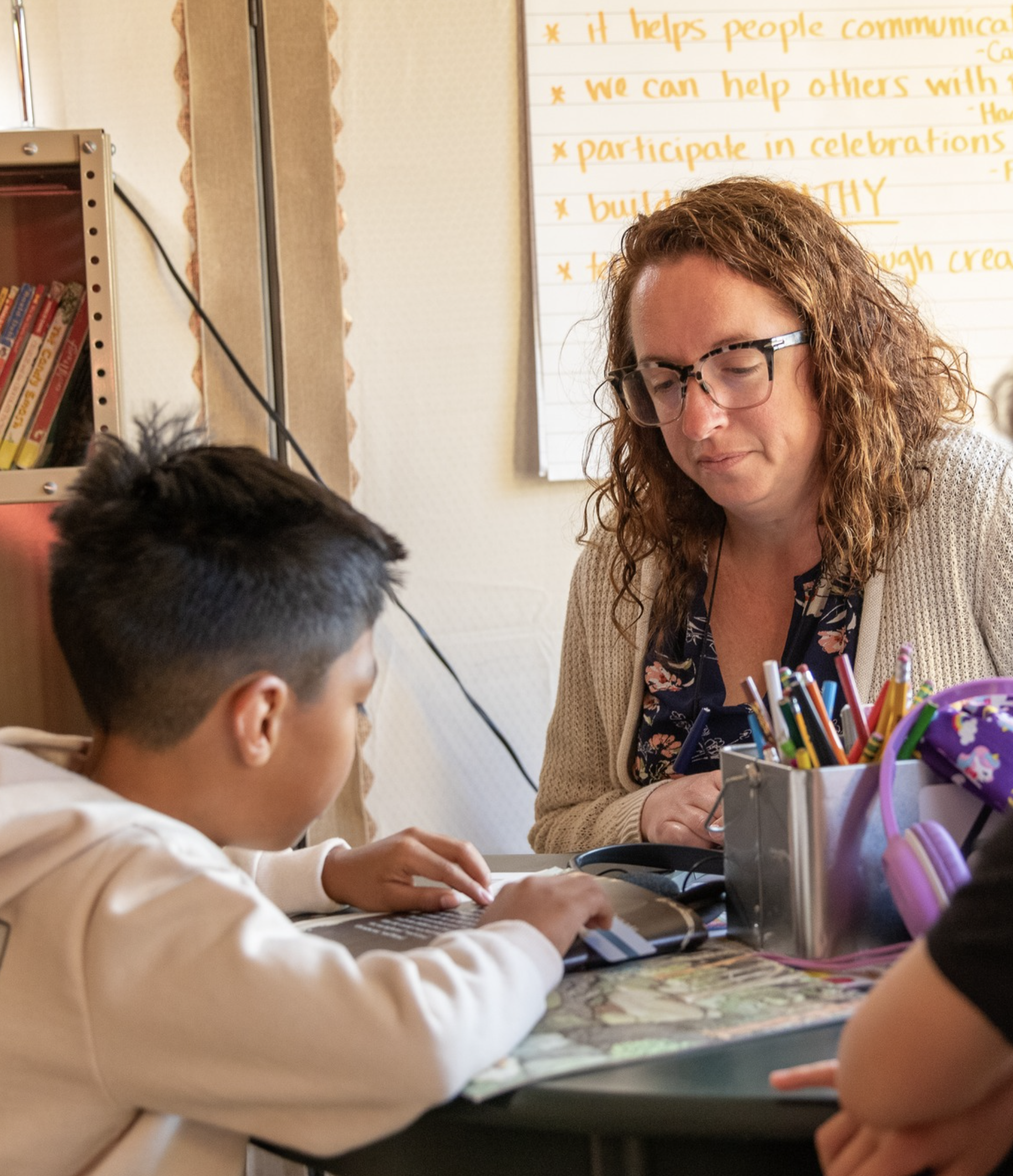 teacher working with a student