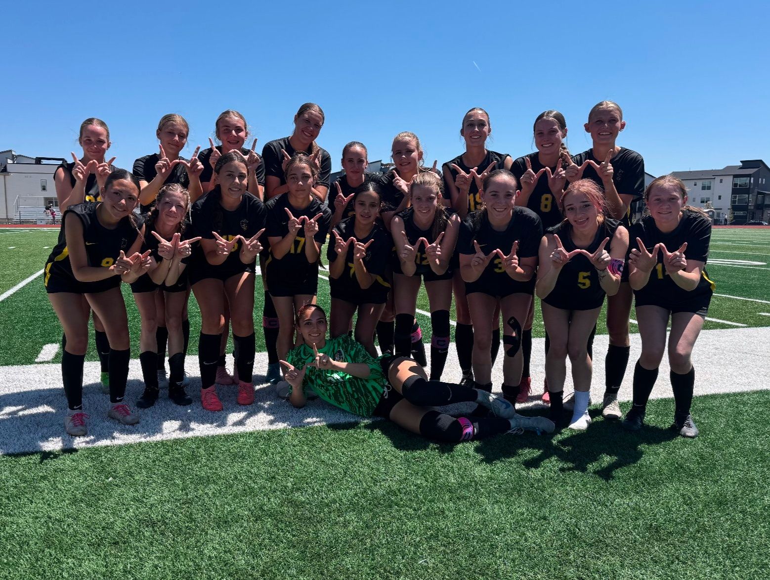 2025 Girls Tennis Team with runner-up trophy