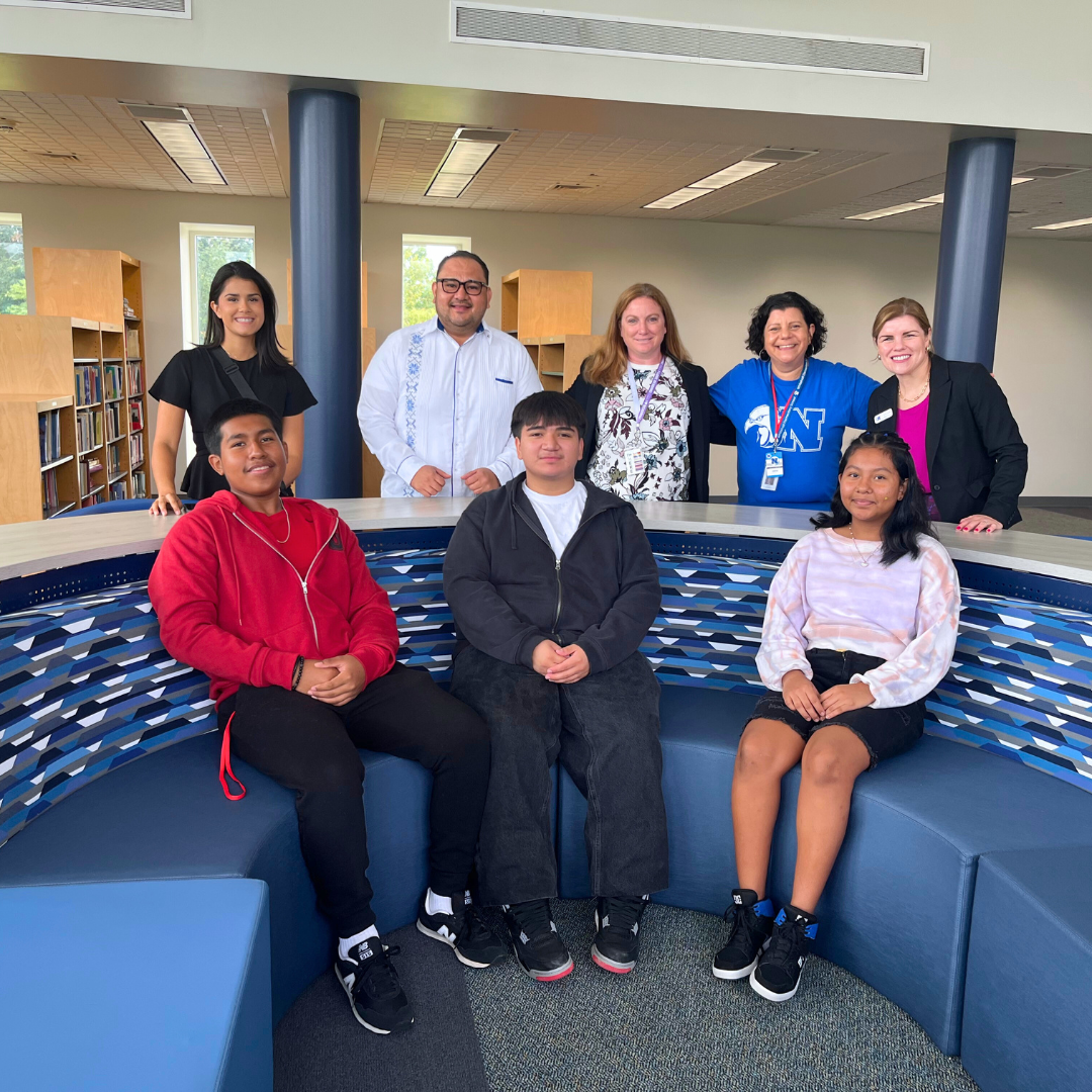 Students and faculty pose for group photo after filming 