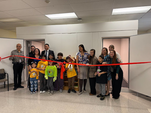 Audiology Booth ribbon cutting with students and staff