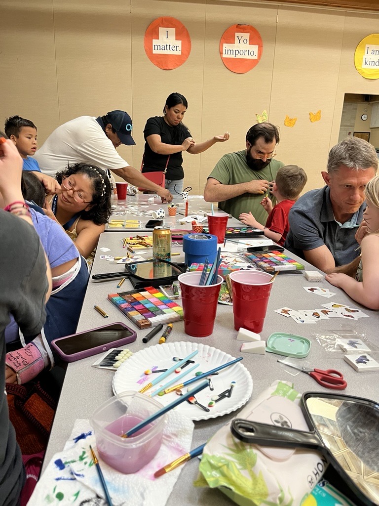 Table of people face painting