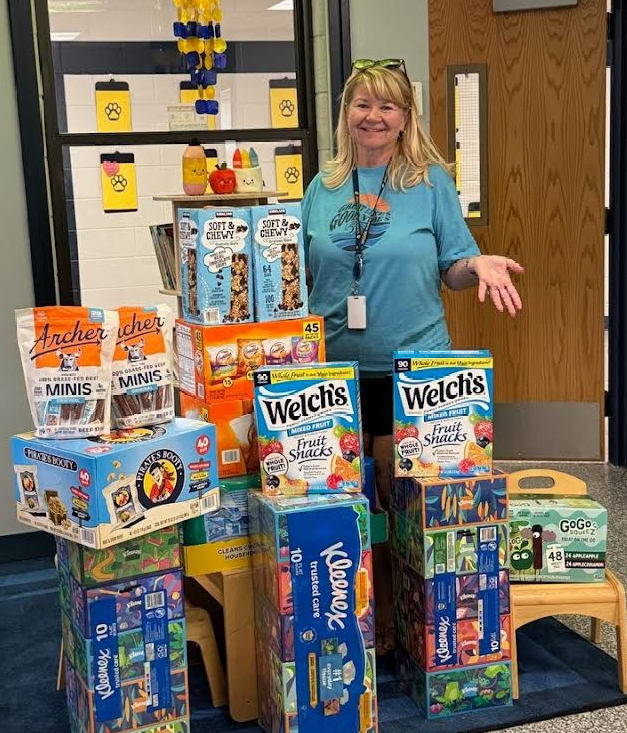 Mrs. Collins showing off BES donations