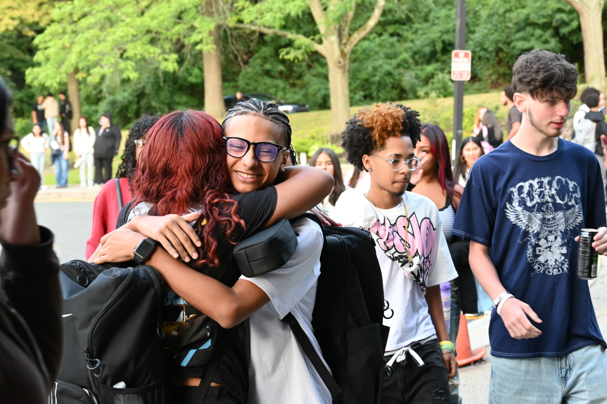 Students hug on the first day of school