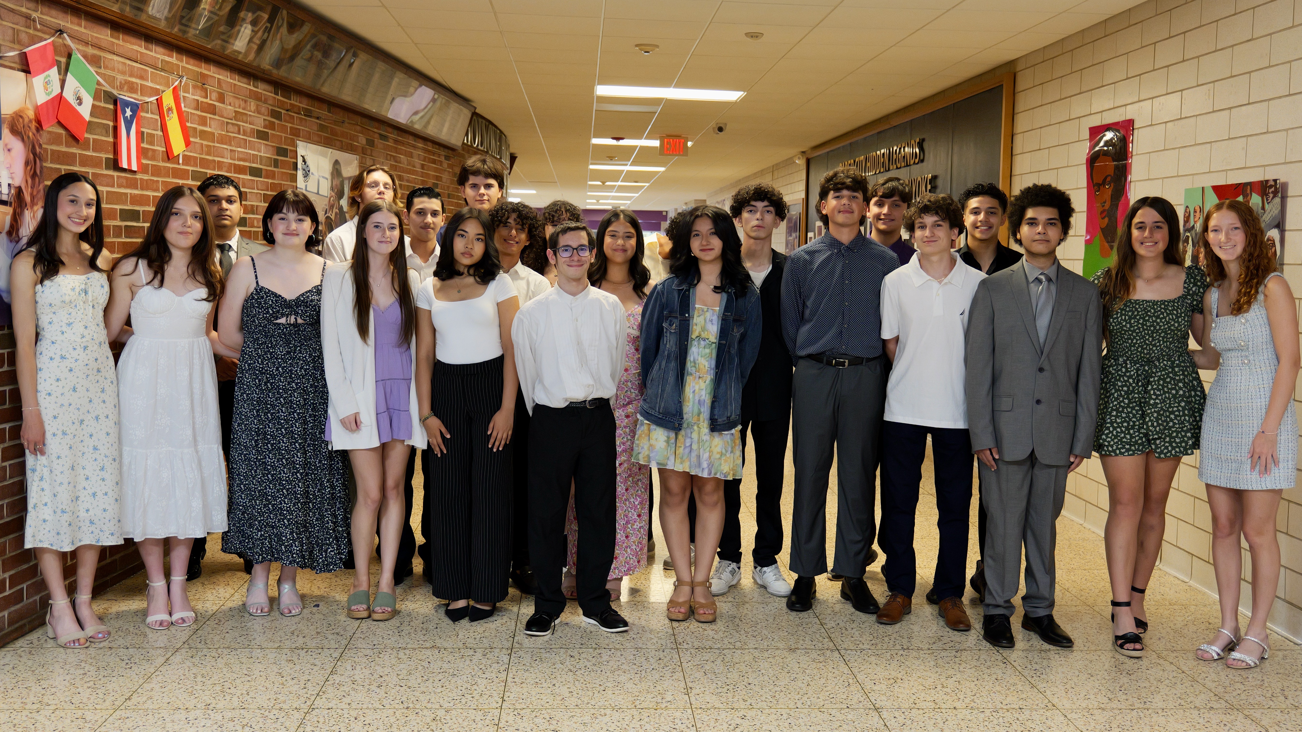 Group of National Honor Society students standing in a hallway