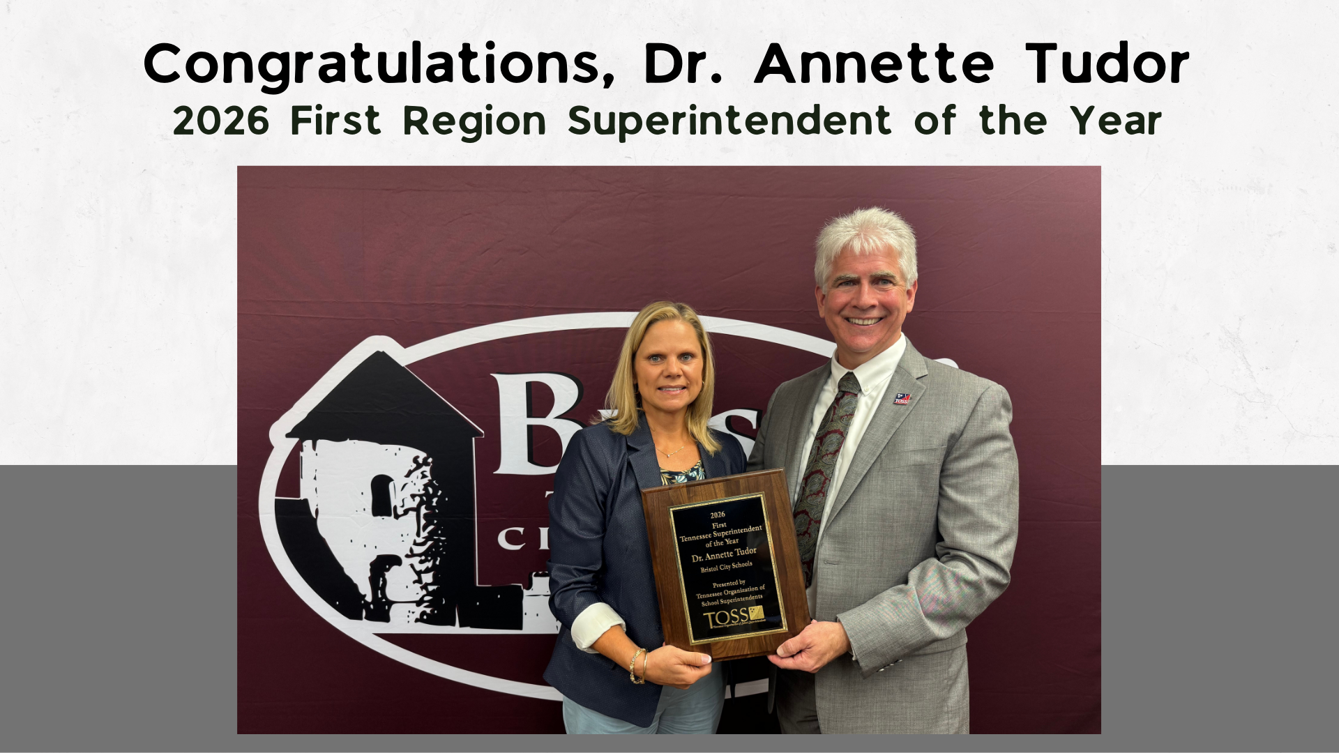 "Congratulations, Dr. Annette Tudor, 2026 First Region Superintendent of the Year" Dr. Annette Tudor, BTCS Director of Schools, stands with a colleague while holding a plaque recognizing her as the 2026 First Region Superintendent of the Year. They are posed in front of a Bristol Tennessee City Schools backdrop. 