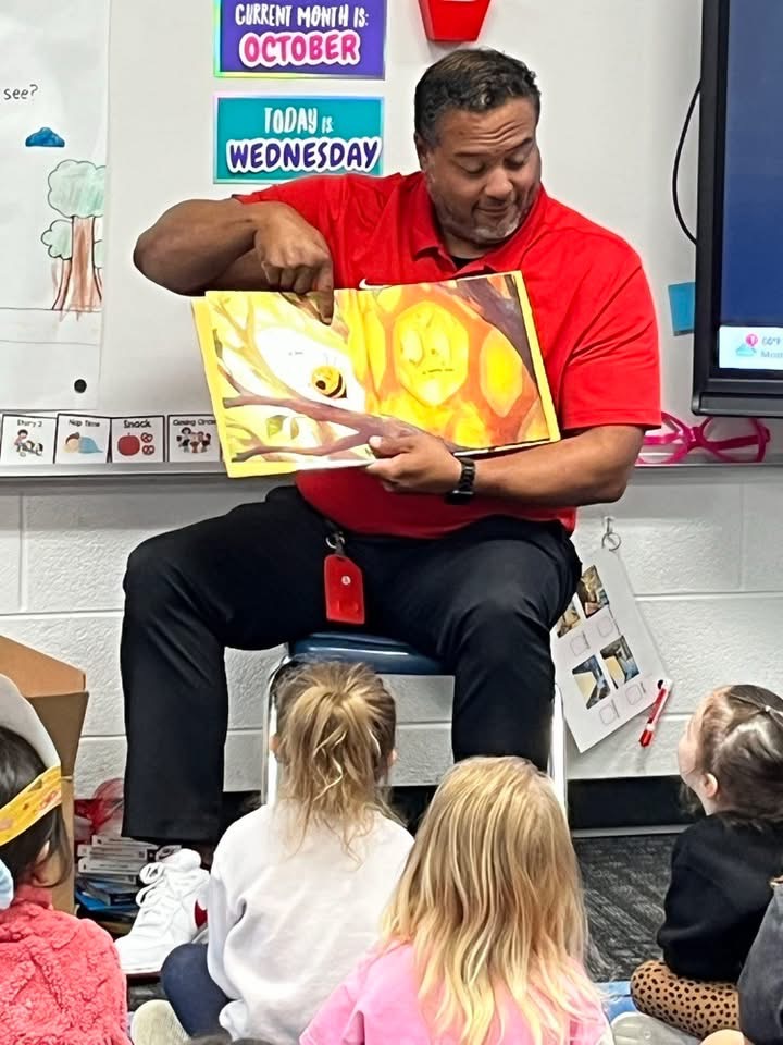 Deputy Superintendent Nick Sun reads to PK