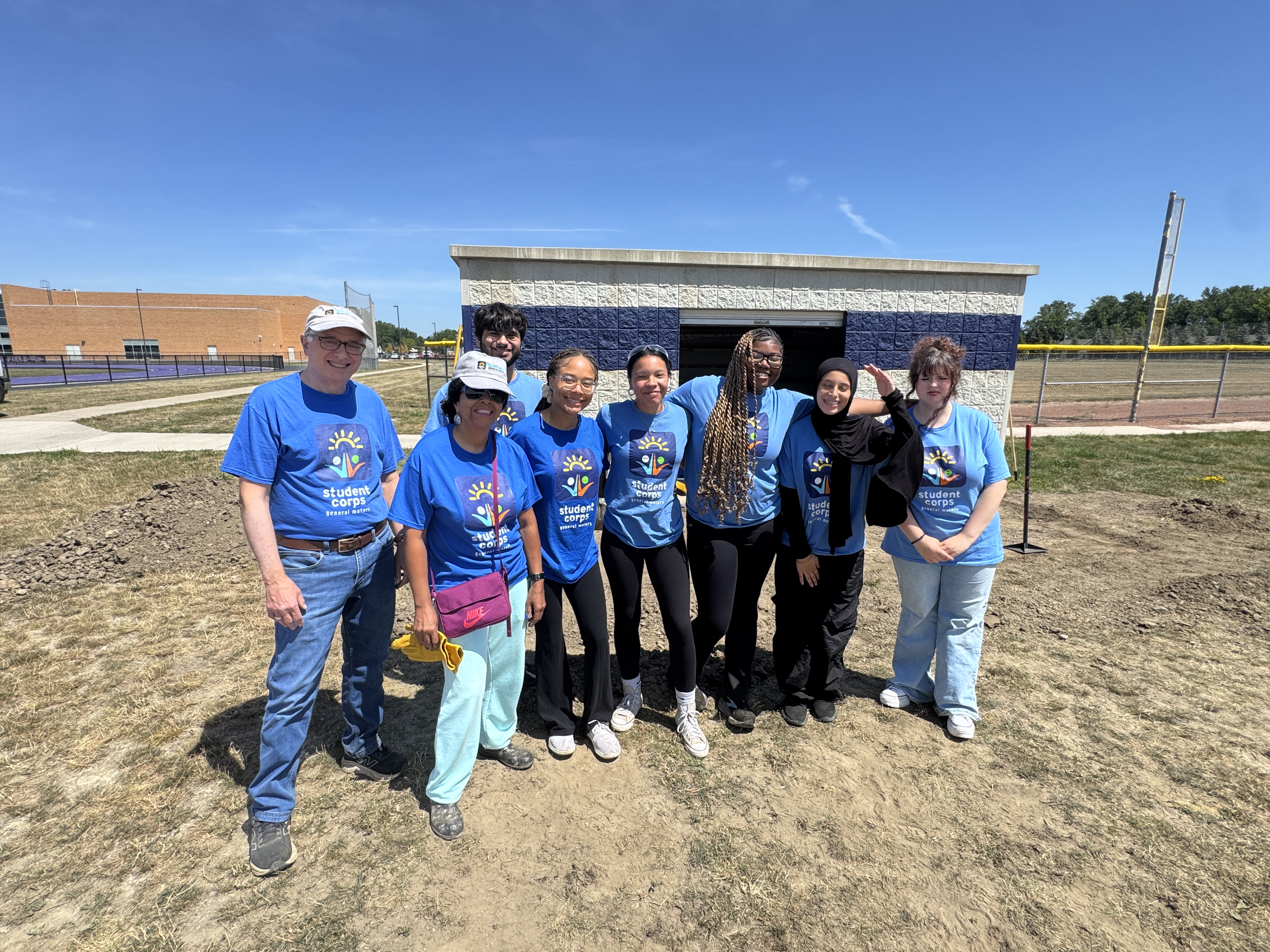 GM Student Corps at WHS adding pavers near the track and field