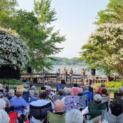 concert in front of a river