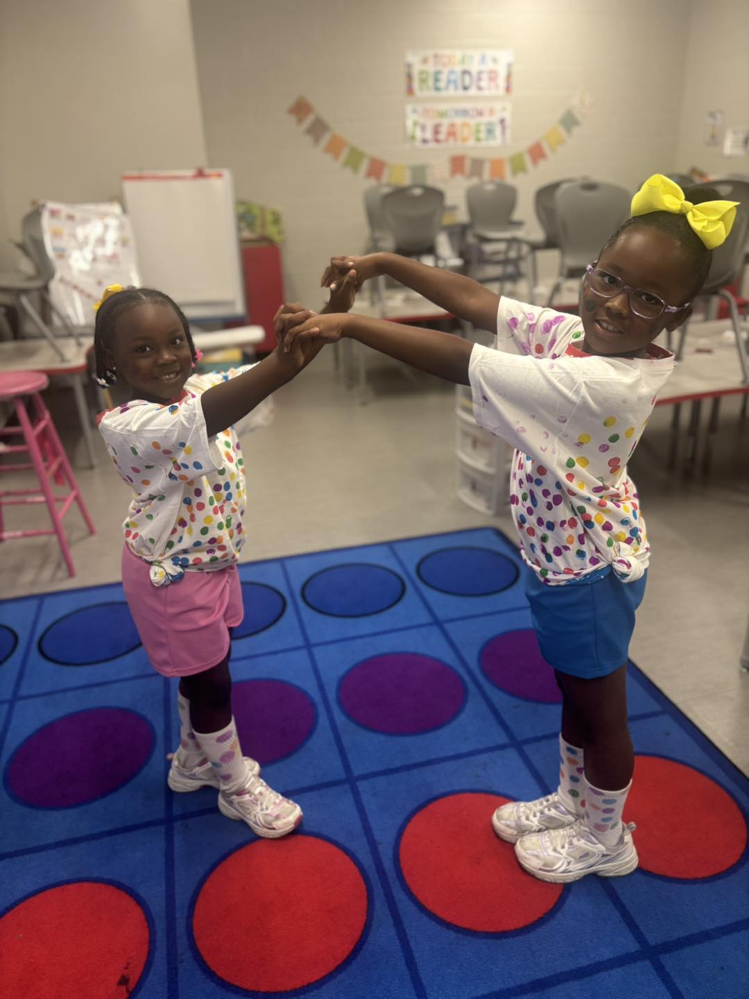 football player and duck greeting students