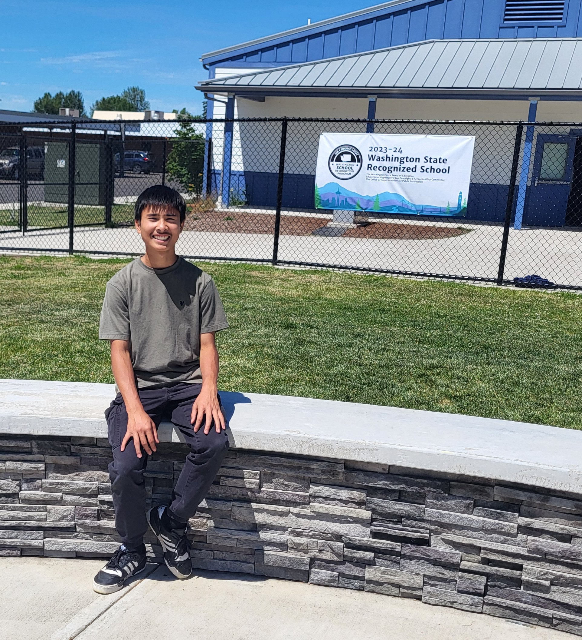 CAM Academy student Toby Nguyen poses for a photo outside of the school