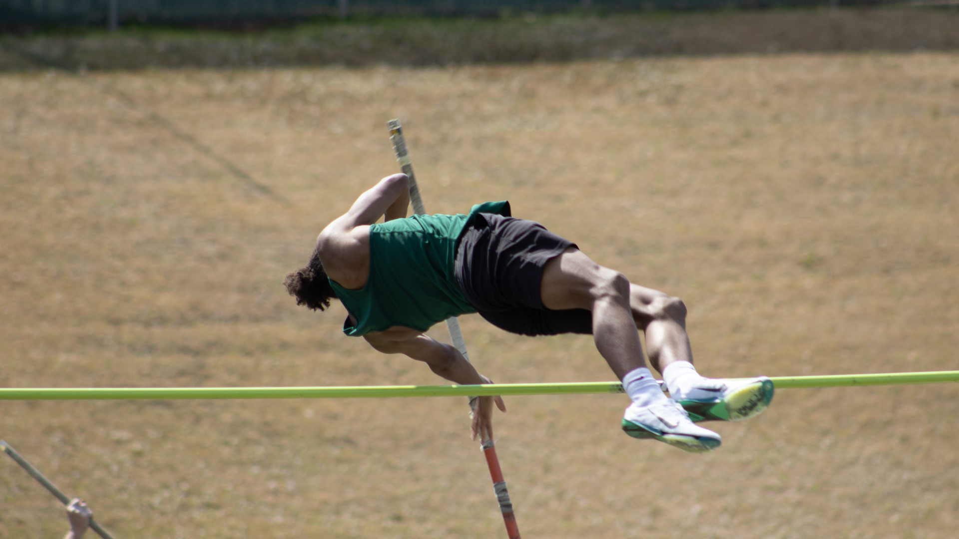 A Lobo Track and Field athlete pole vaults at a recent event.