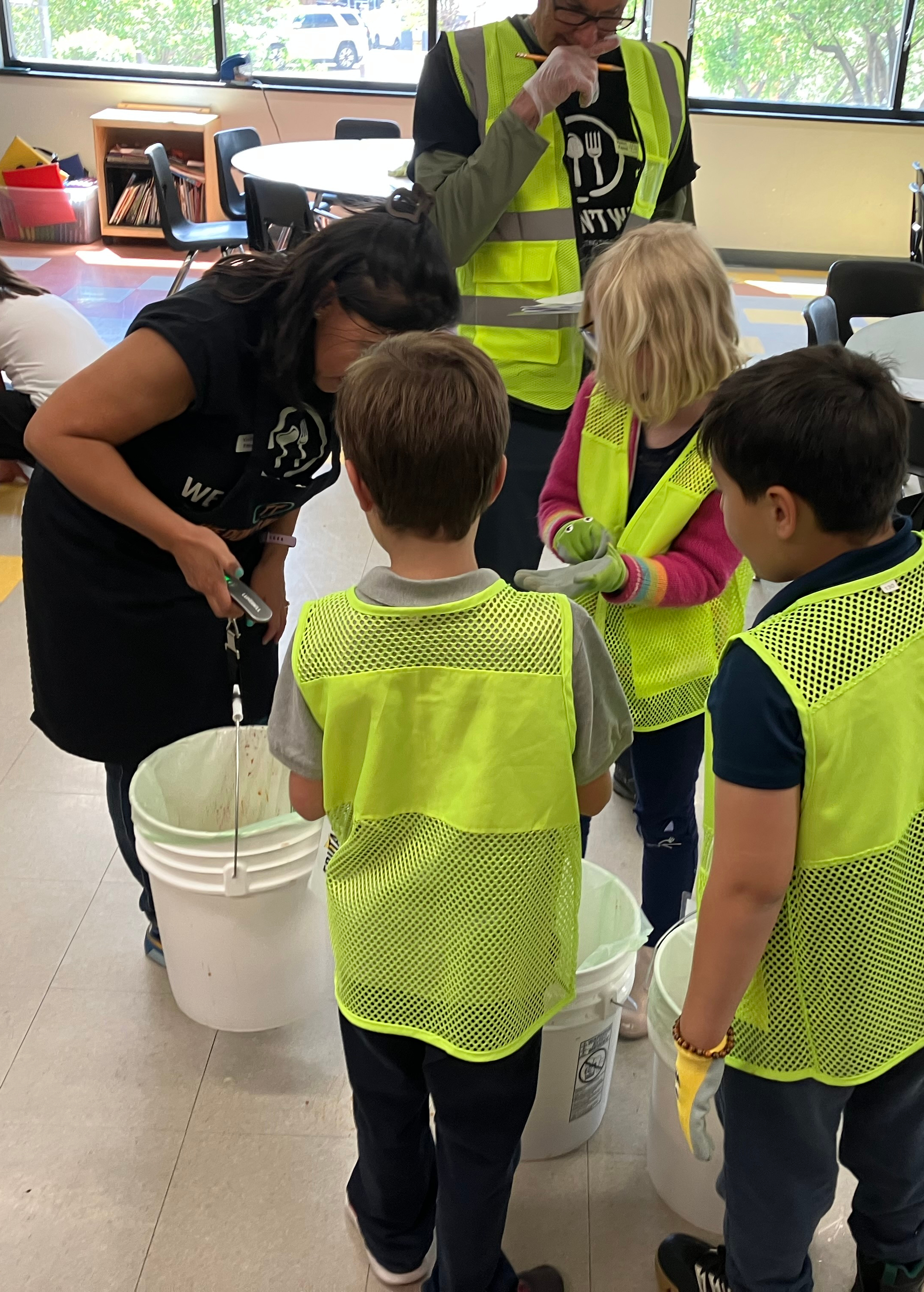 students and staff doing a cafeteria waste audit