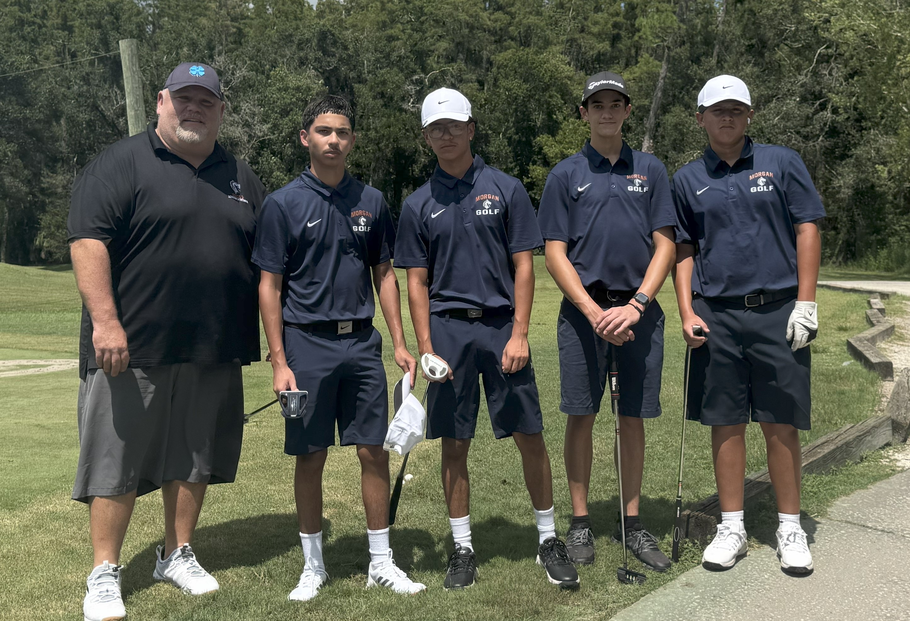 golf team members pose for a picture